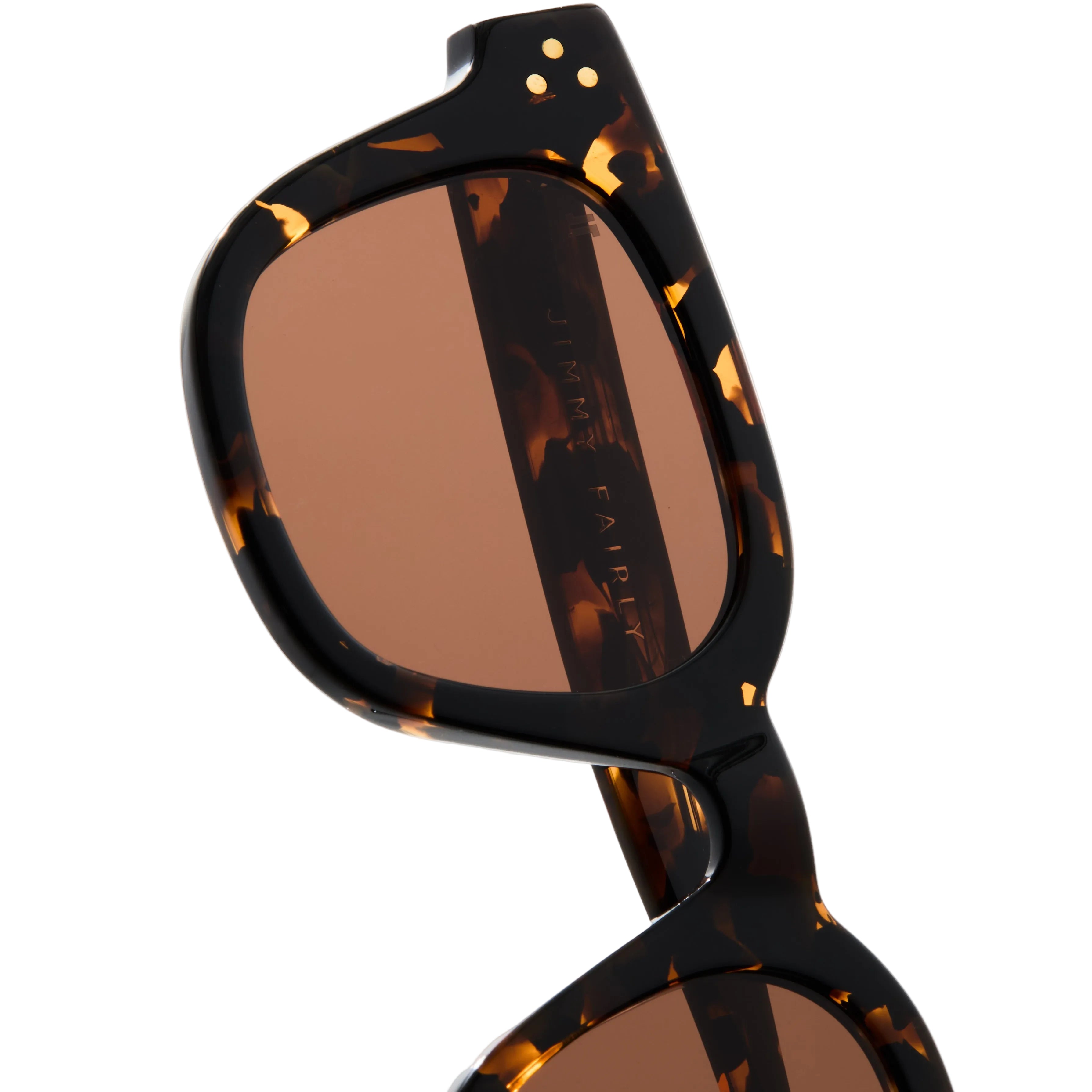 Sunglasses with tortoiseshell frame and brown lenses on a white background